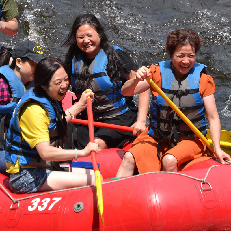 A group whitewater rafting