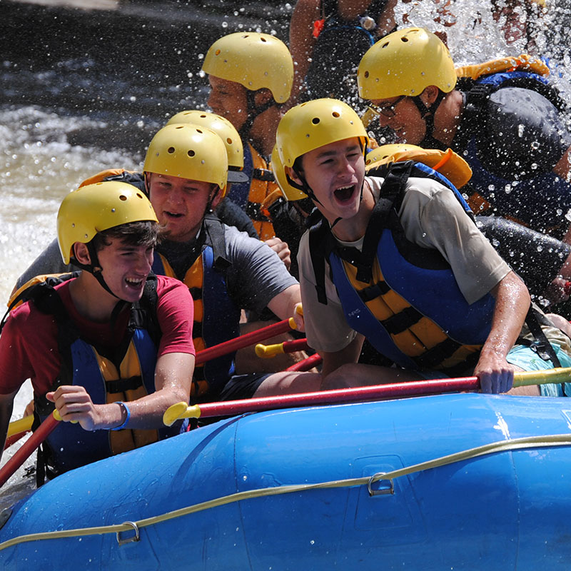 A group whitewater rafting